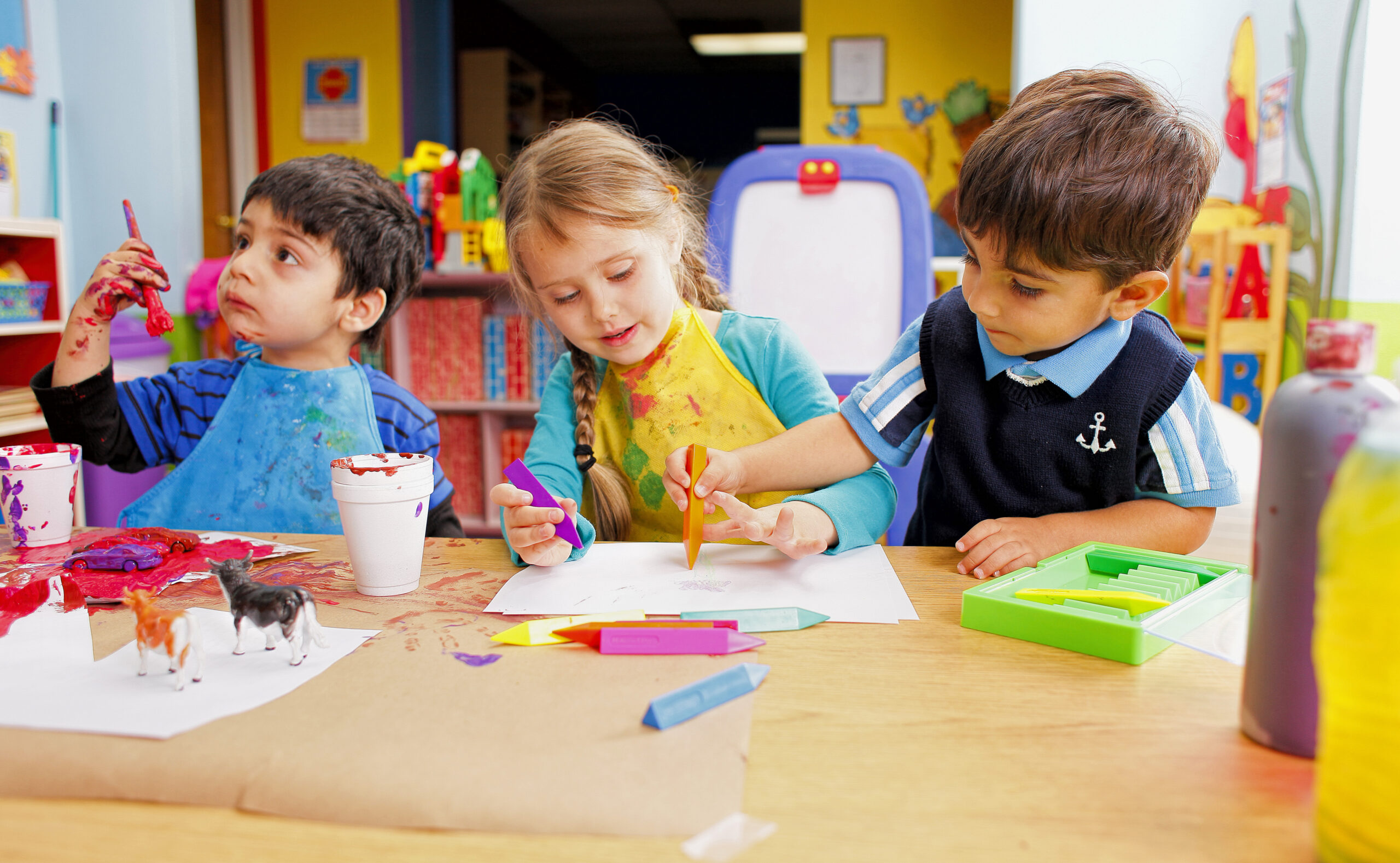 3 kids painting together