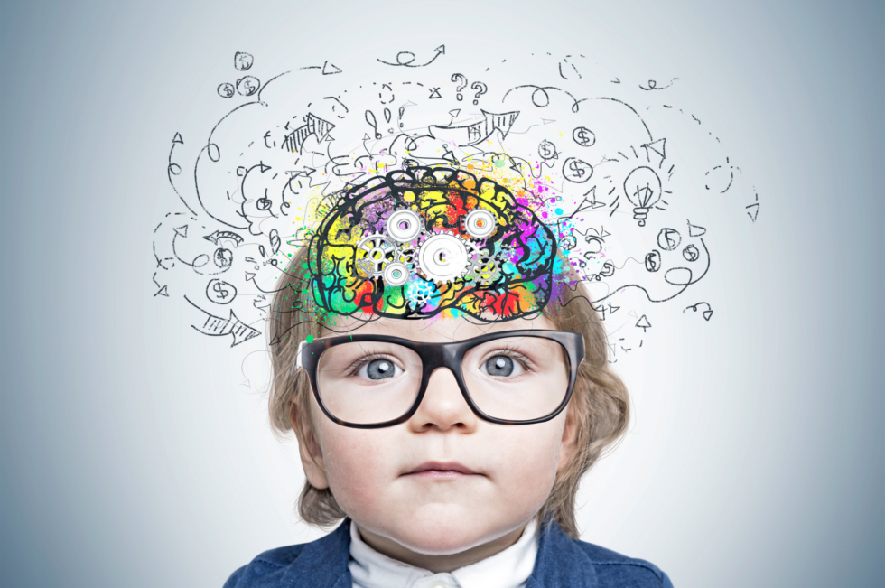 boy with glasses and an illustration of his brain